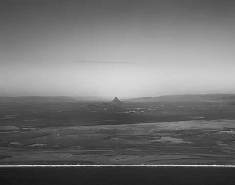 Between the Silence of Things, black-and-white scenes of presence among trees, birds, water and wasteland